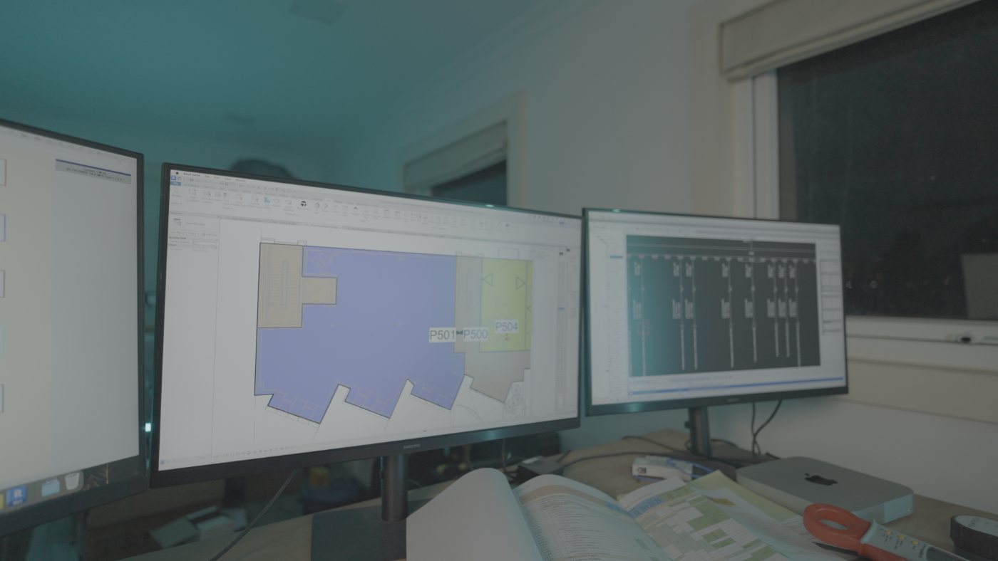Electrical design work on a floor plan across dual monitors