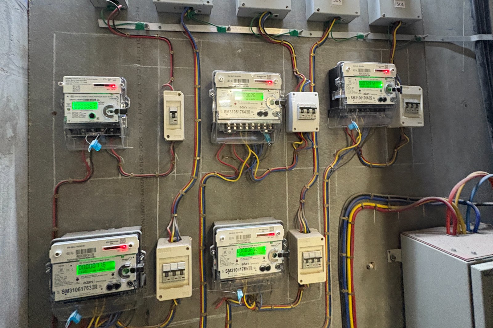A wall of smart electricity meters and wiring in a completed building