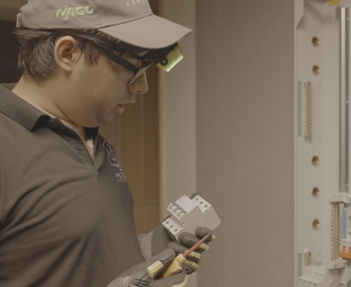 ProtegoPlus engineer selecting and installing protective devices in a distribution board